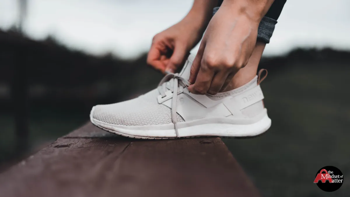 woman tying her shoes