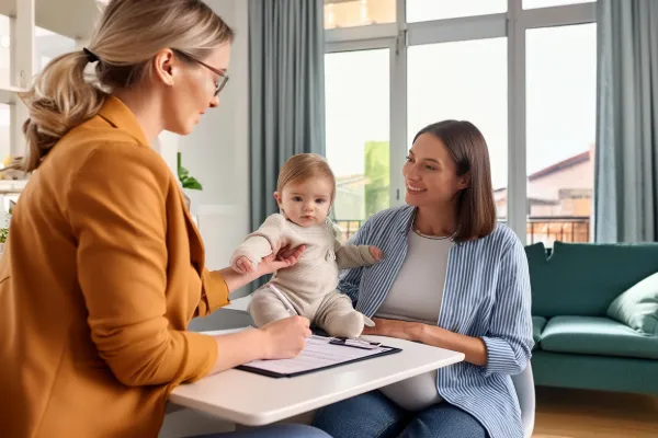 Mother receiving guidance from a maternal and infant health consultant