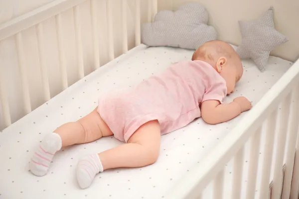 Peaceful baby sleeping comfortably in the morning light
