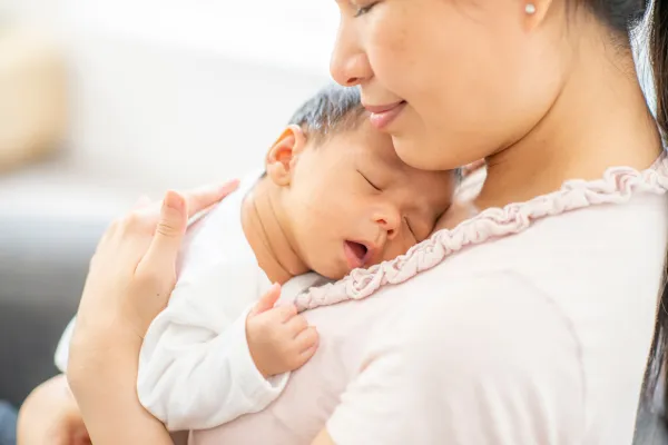 Mother soothing baby in a serene nursery room