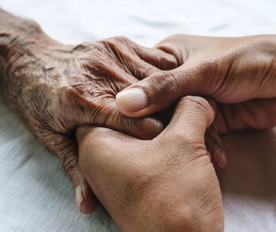 people of different ages holding hands