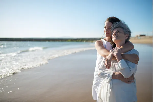 mom and daughter in the beach