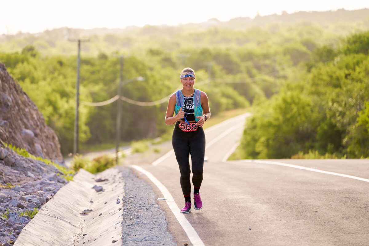 Beginner runner training for a marathon on an outdoor road with a structured training plan
