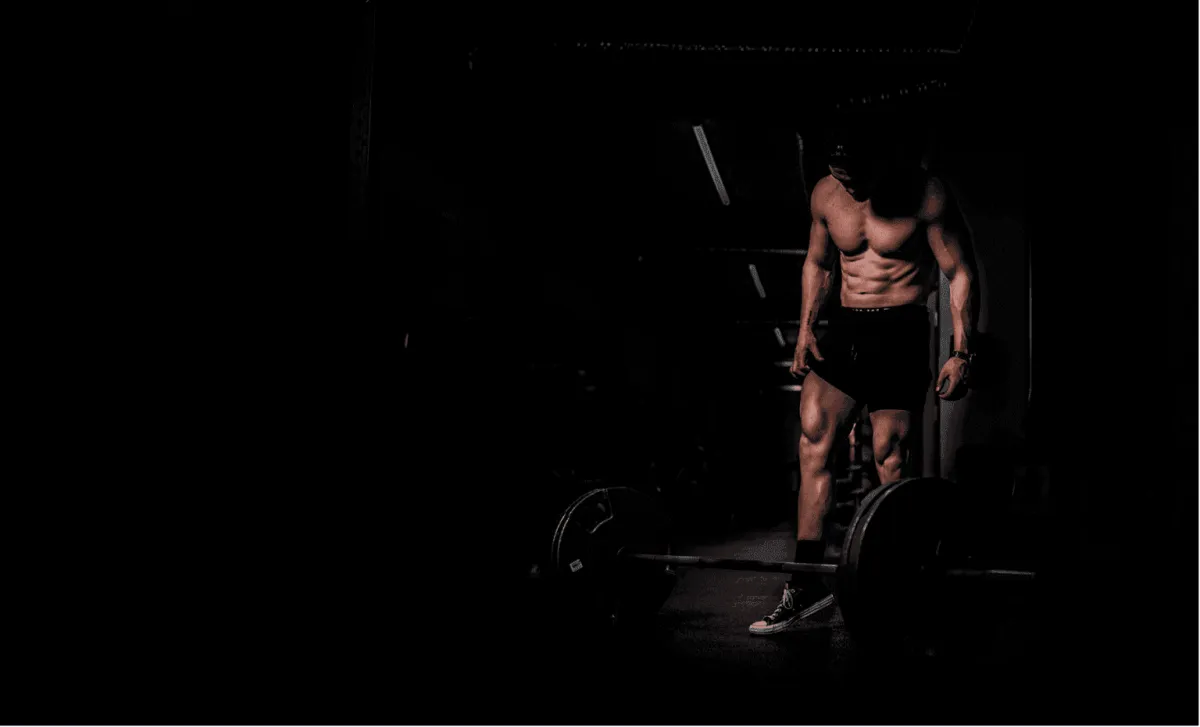 Personal trainer providing one on one fitness training to a client in San Mateo gym environment