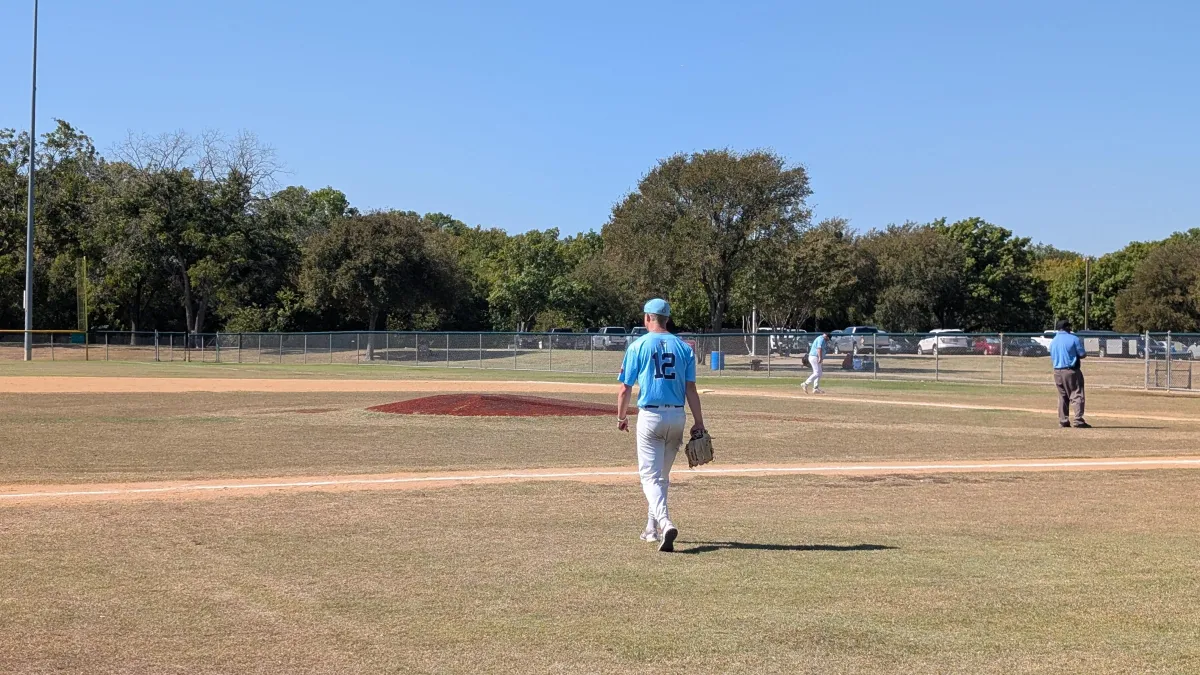 Pitcher Dylan walking to the mound