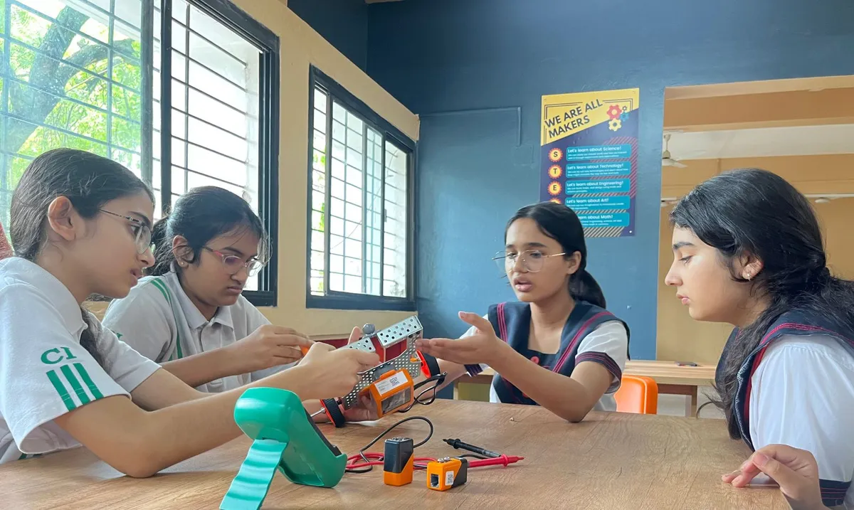 Children working on a hands-on school technology and robotics activity