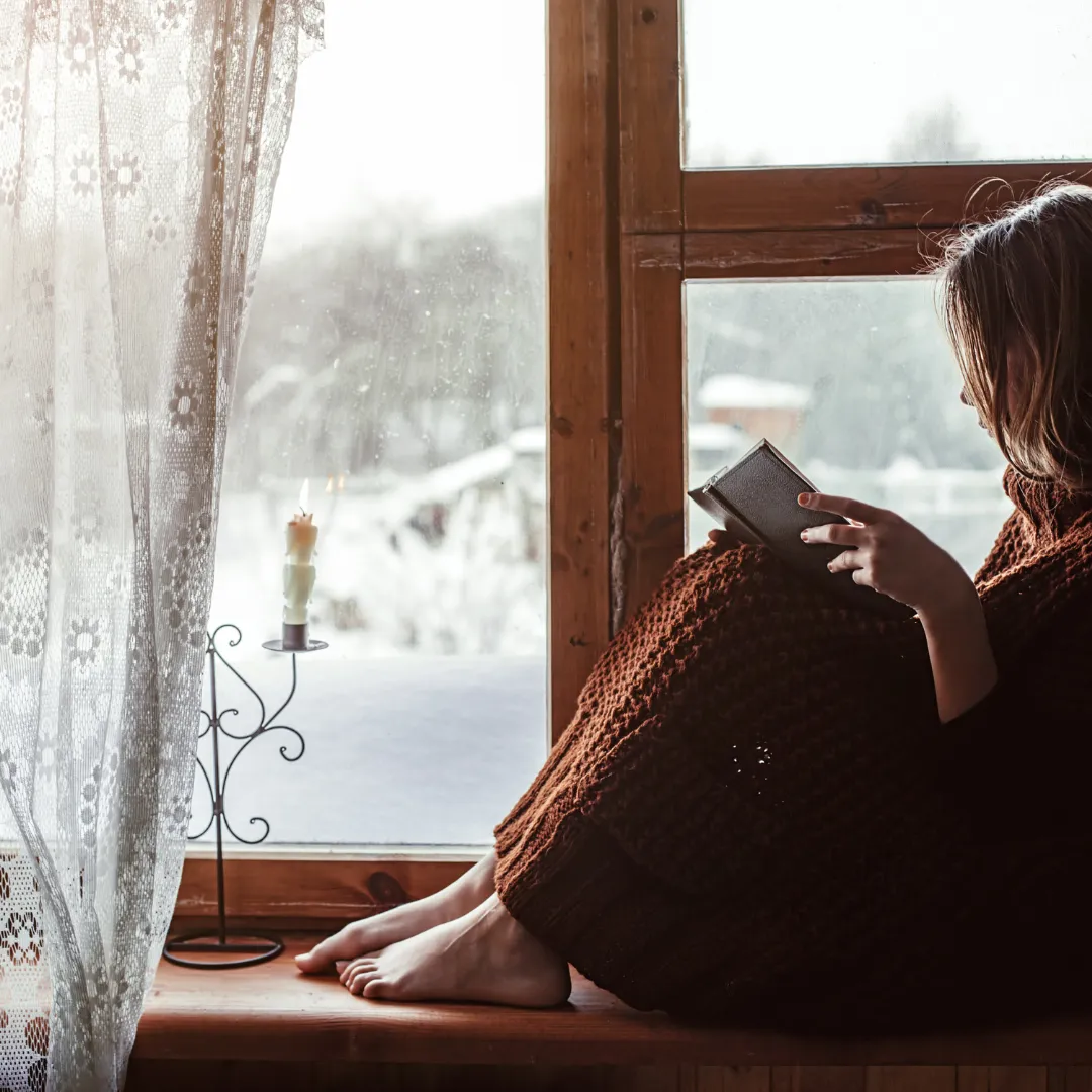 Woman sitting in window
