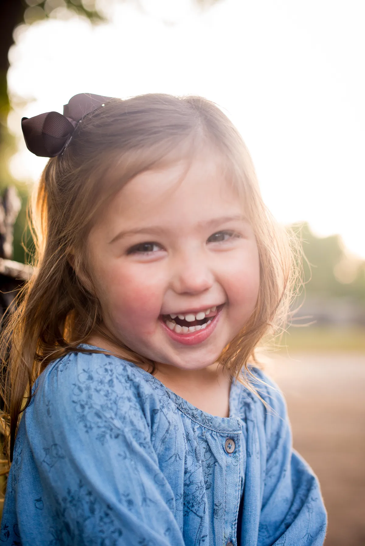 St. Louis Family Photographer little girl in a field smiling