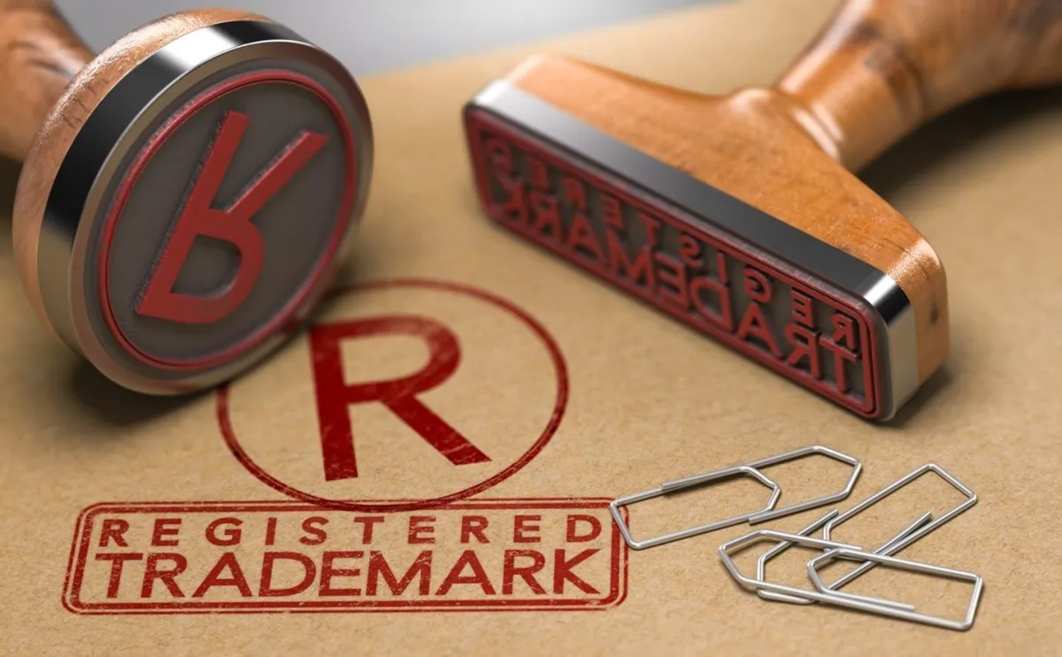 Registered trademark red stamp on brown paper