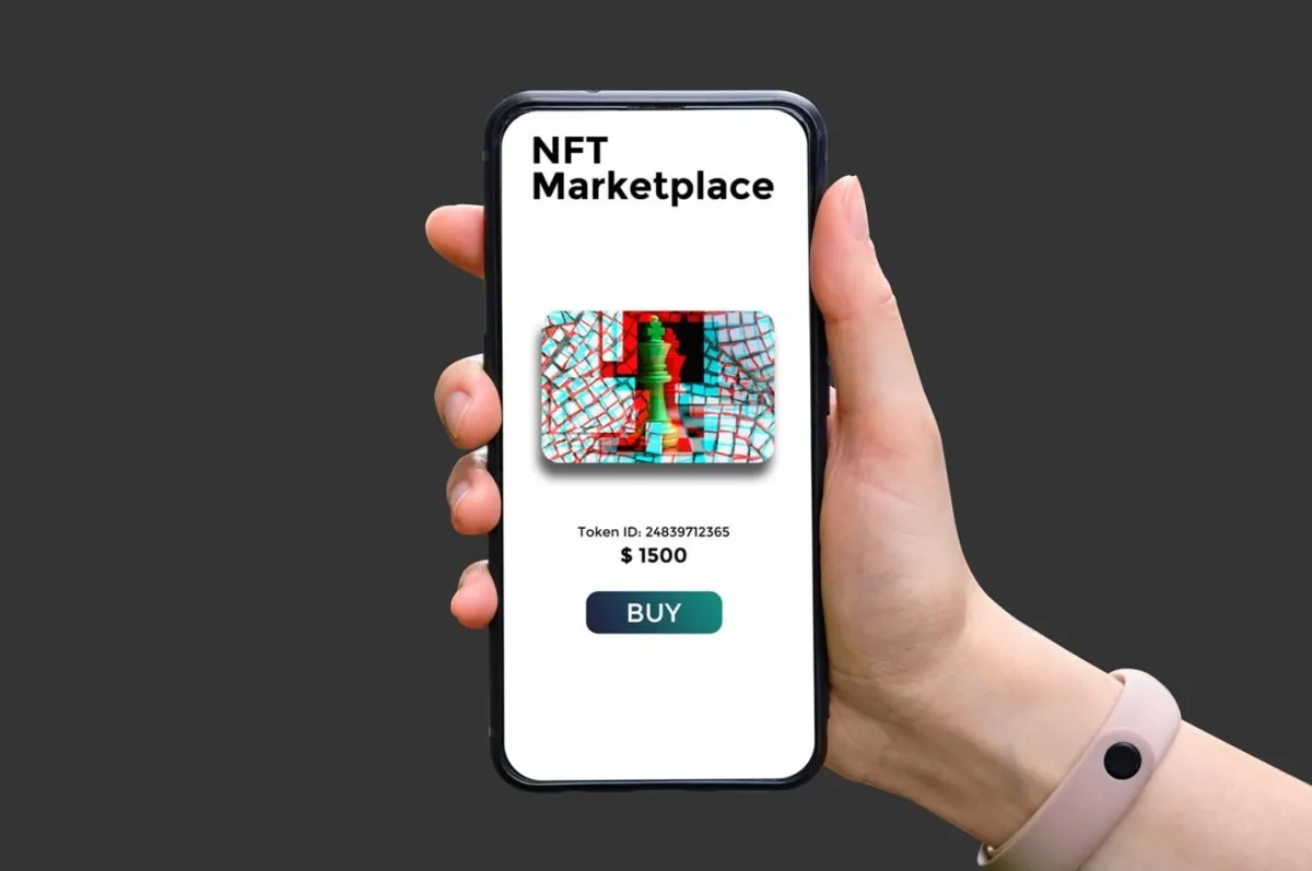NFT marketplace on screen of smartphone in hand