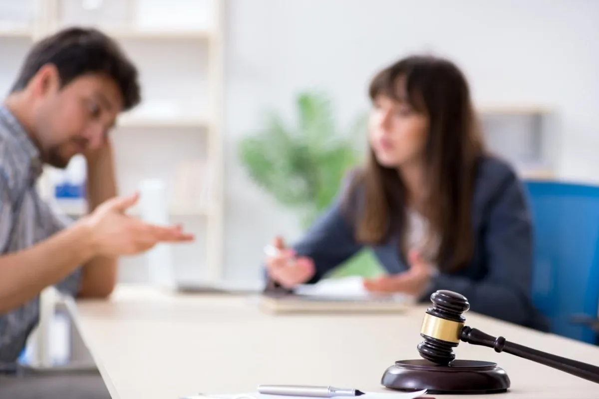 Attorney explaining trademark application processes to a client.