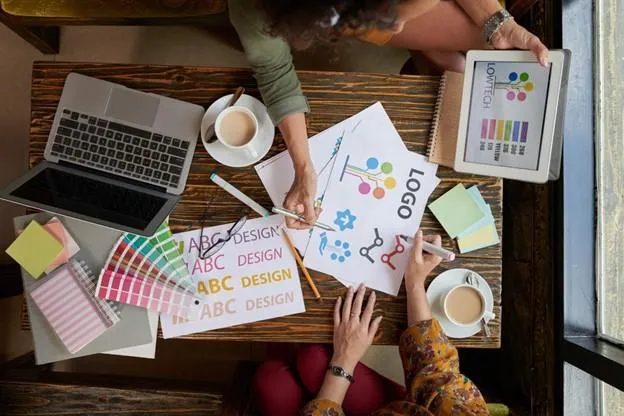 Creative team working on new trademark design for startup company.