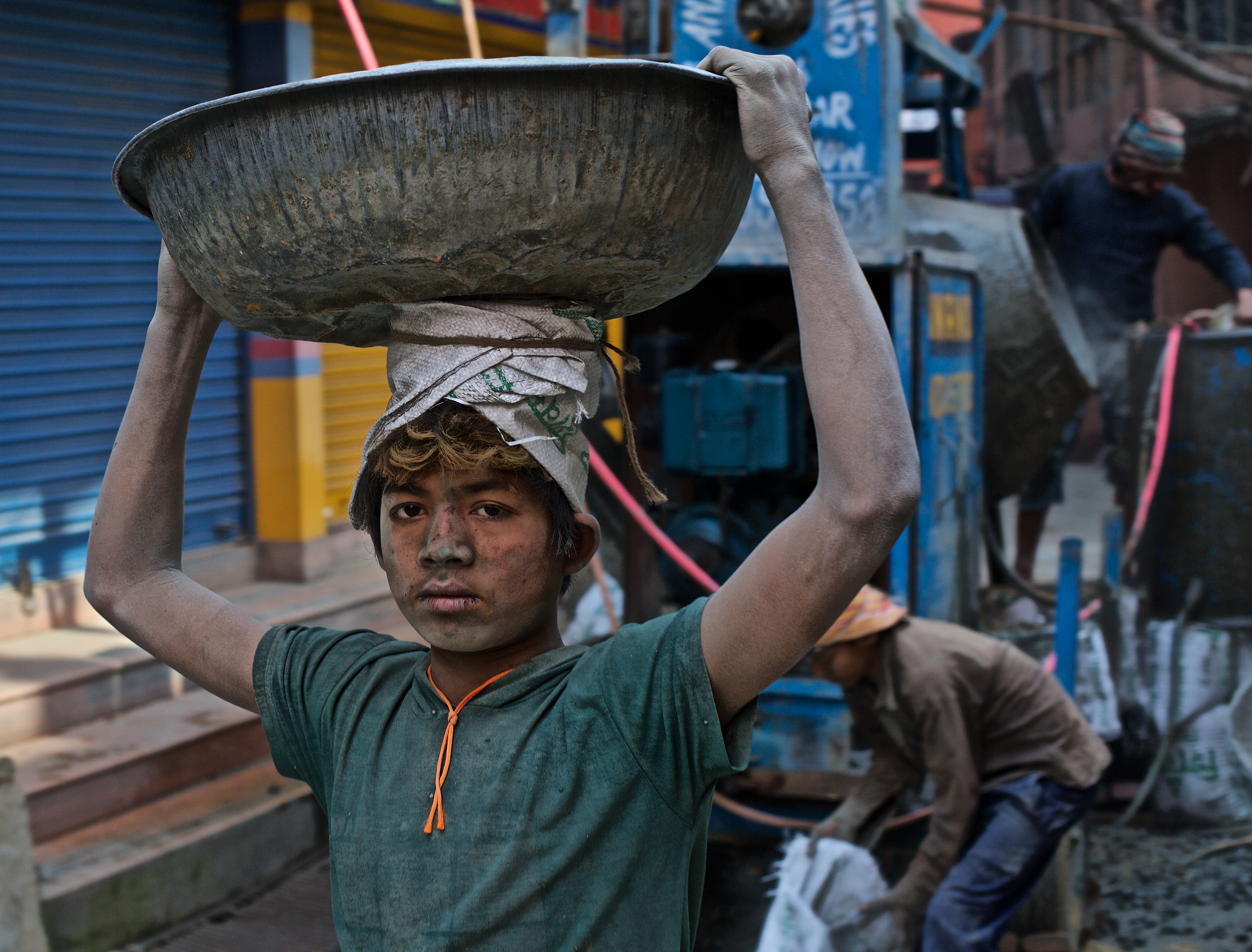 A young boy working instead of going to school