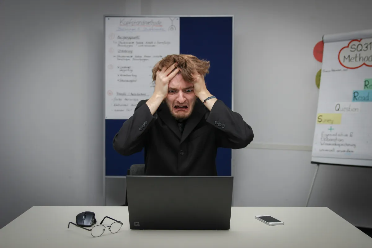 Frustrated Australian small business owner overwhelmed by Fair Work compliance paperwork