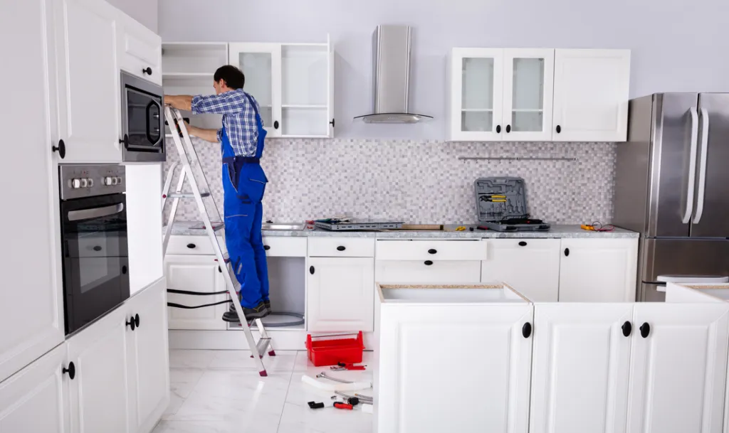 cerletti & kennedy remodeling; contractor during kitchen remodeling installs new kitchen cabinets