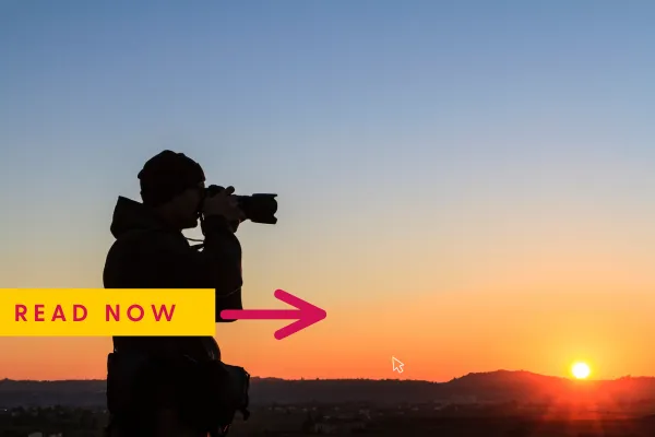 Photographer editing a portfolio website on a laptop using the best photography website builder with affordable web design tools.