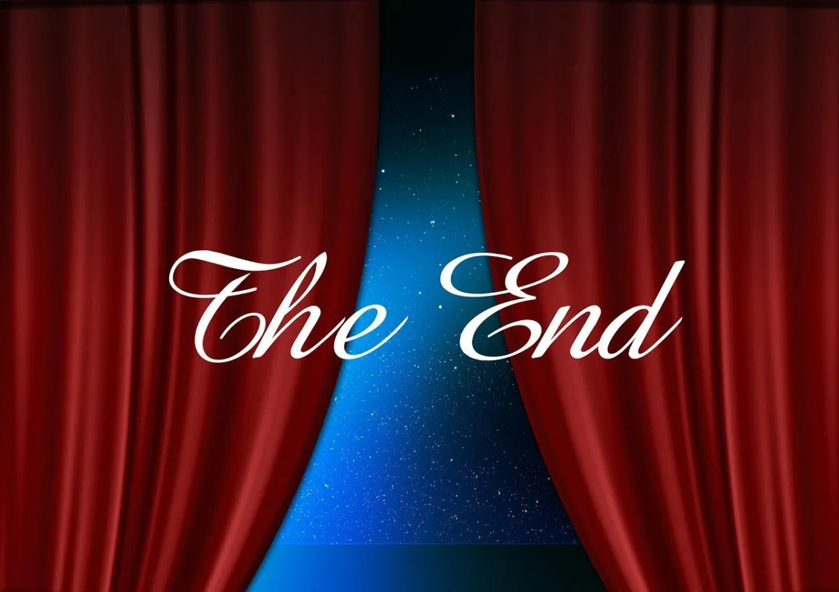 Stage curtains closing with the words "The End" written in the middle of the page