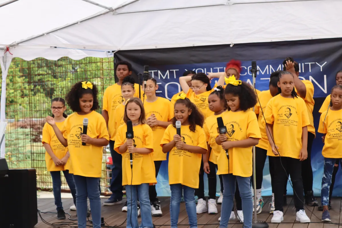 The MLK Jr. All Children's Choir's performance at the Annual Juneteenth Event was a fitting tribute to the values of freedom, community, and unity. Their music resonated with the audience, echoing the spirit of Juneteenth and the enduring message of Dr. King. This event reminds us that, as a community, we have the power to make a positive impact, empower our youth, and honor the vital role of fathers in shaping the future. It's a celebration of history, hope, and the harmonious voices of change.