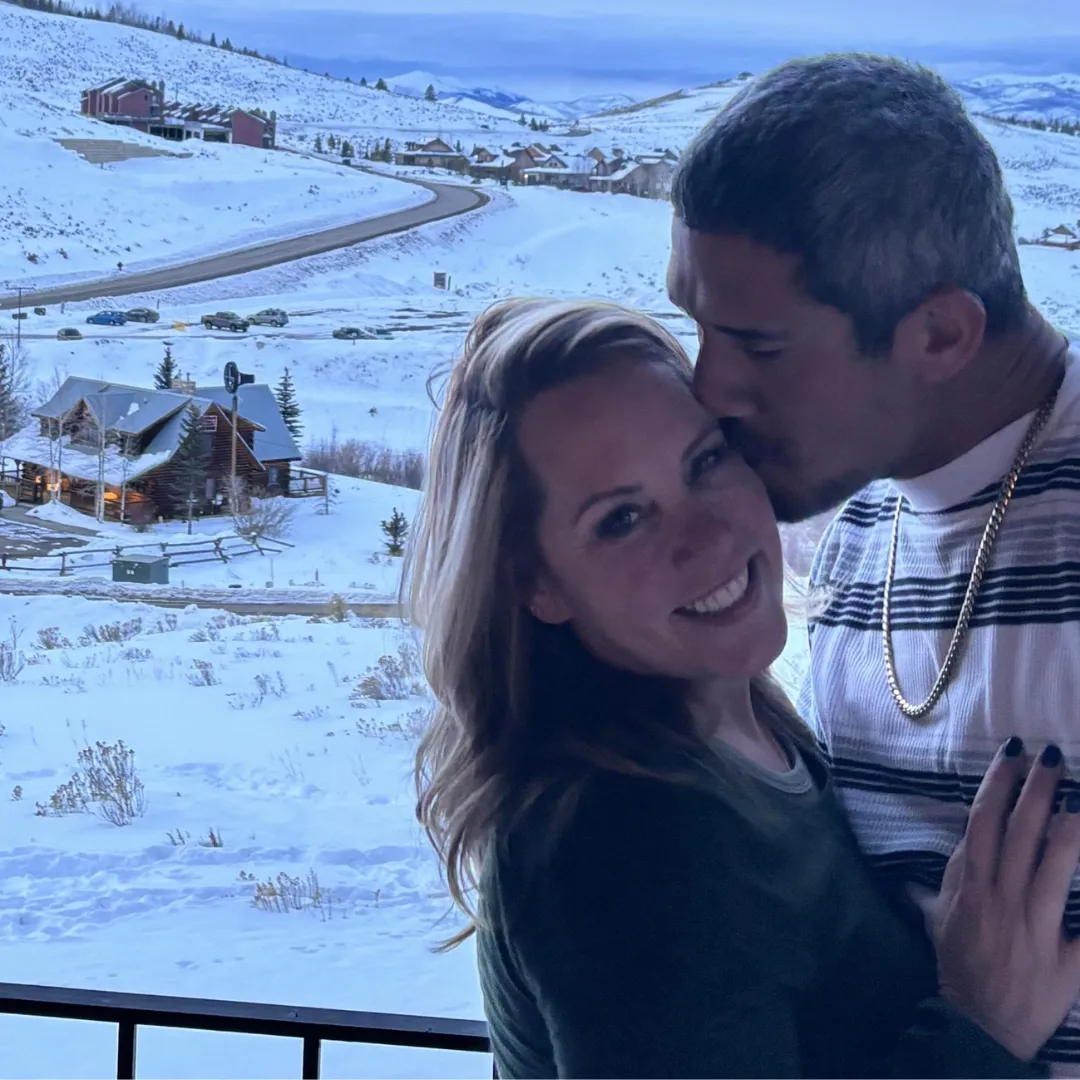 Michelle Lee and her husband hugging each other