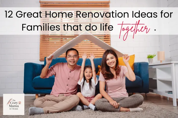 Family of three at home sitting cross legged on floor in living room under bent cardboard that looks like a triangle roof over them.