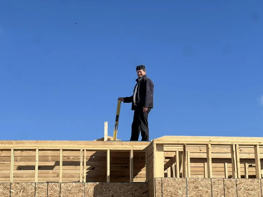 Brandenberger Contracting Solutions team working on a residential roof in Fort Wayne, showcasing family-owned craftsmanship and quality service.