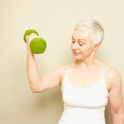 Middle aged woman weight training