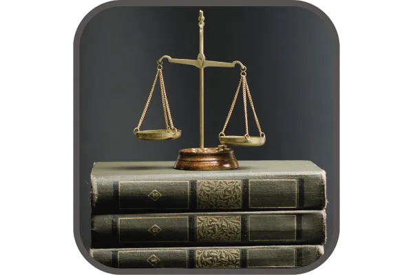 The scales of justice on top of a stack of books