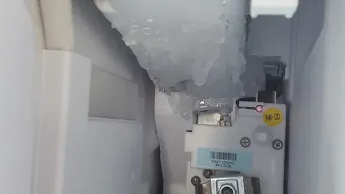 icemaker covered with ice