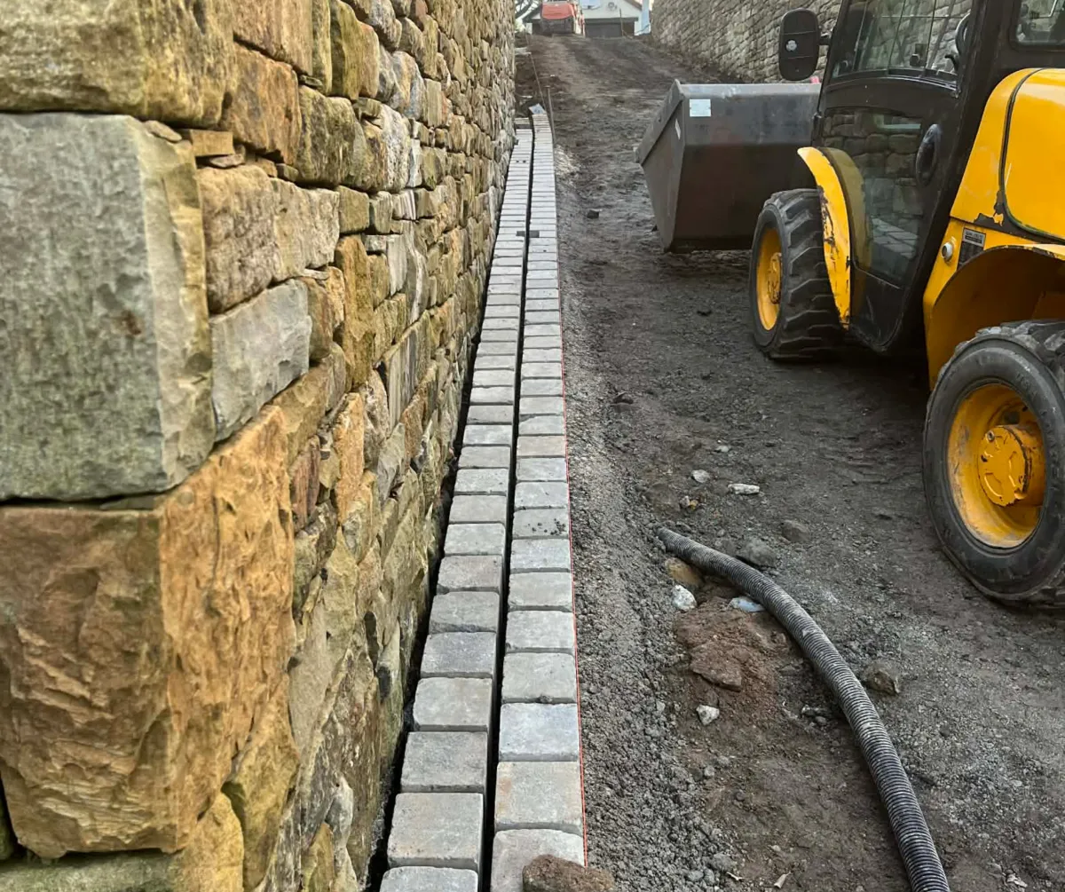 Stone retaining wall and drainage installation project in Lancashire