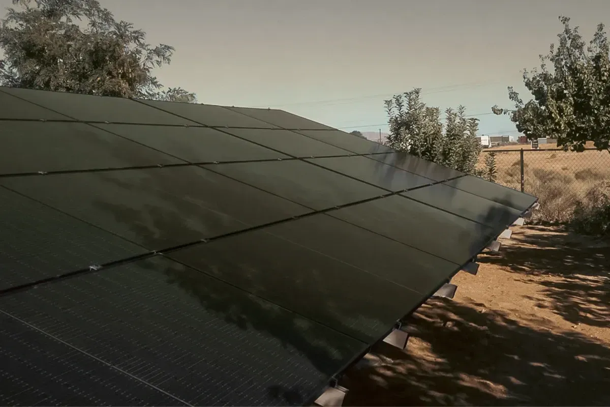 A solar panel half covered by shade