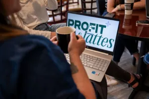 woman with coffee and laptop
