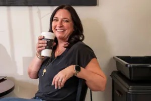 woman with coffee and laptop