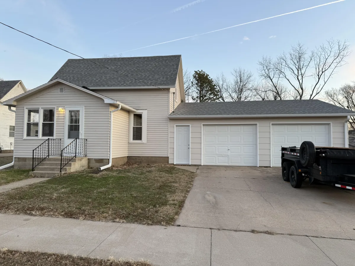 After repaint: cohesive color scheme and crisp detailing on residential exterior