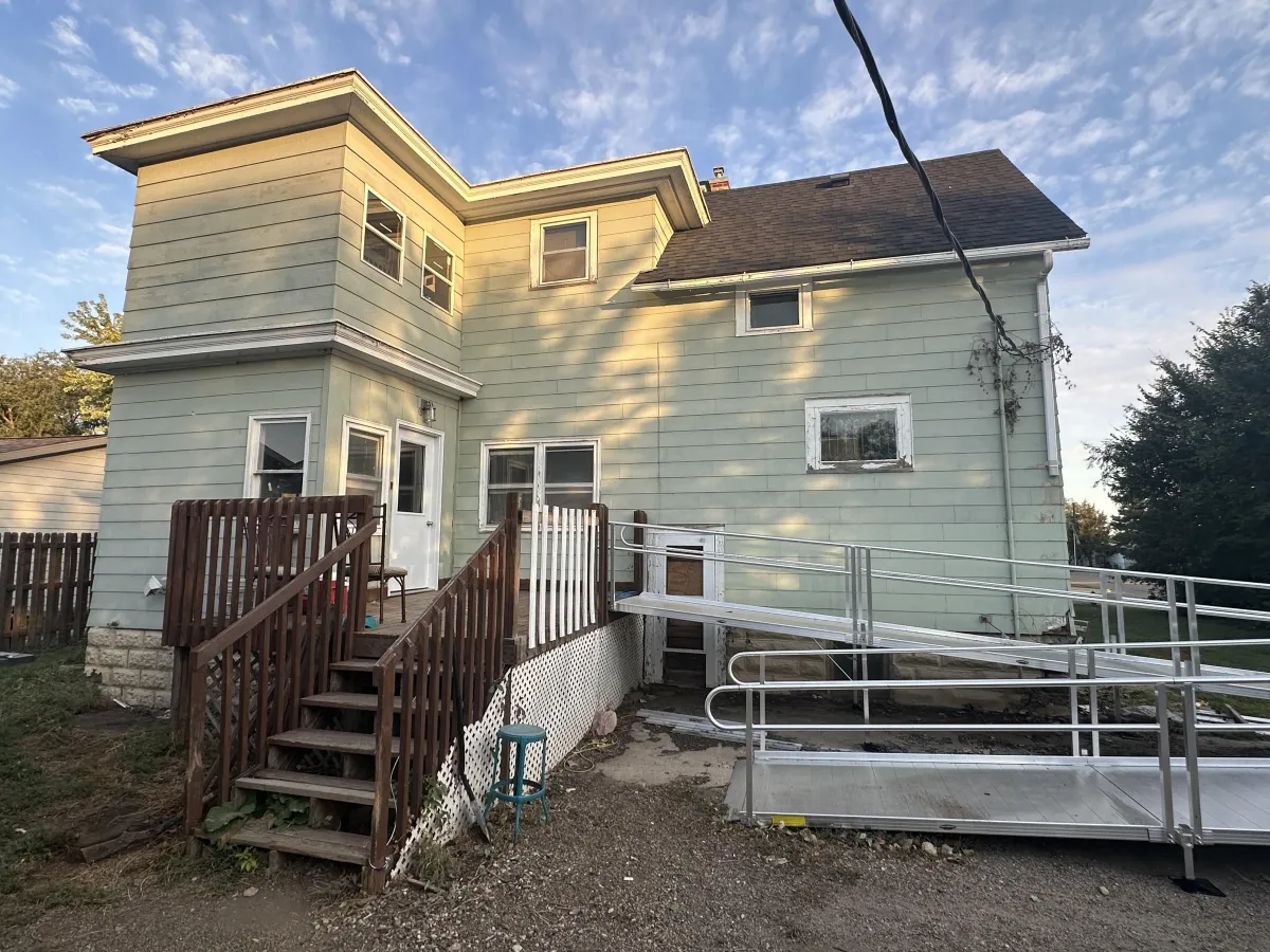 Before exterior painting: uneven color and visible weather damage