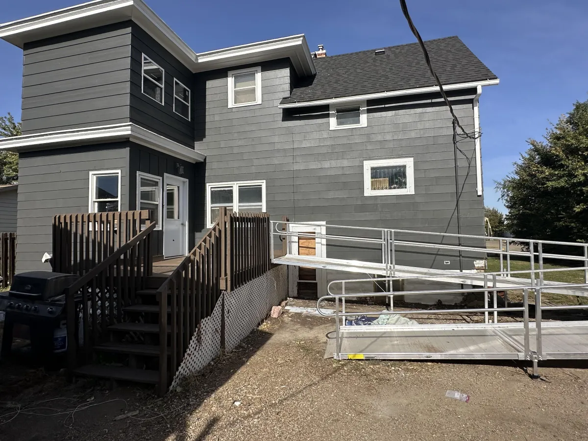 After exterior repaint: sleek, revitalized siding with crisp lines and coverage
