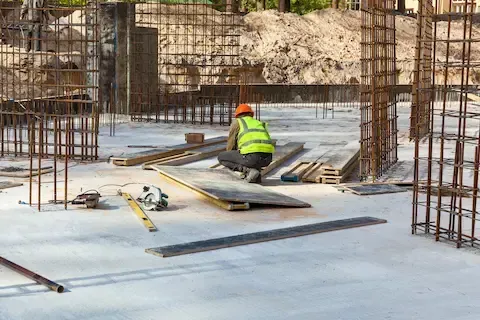 Steel reinforcement work strengthening commercial structure during exterior renovation