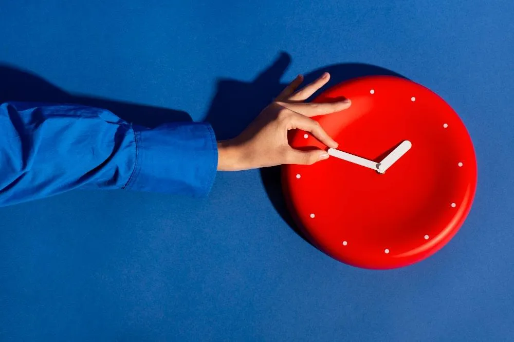 Business owner changing time of clock hands