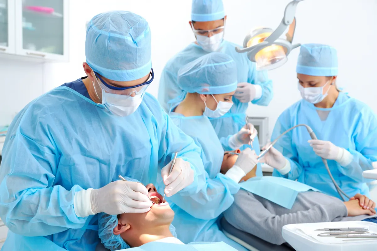 Oral Surgeon doing a dental procedure