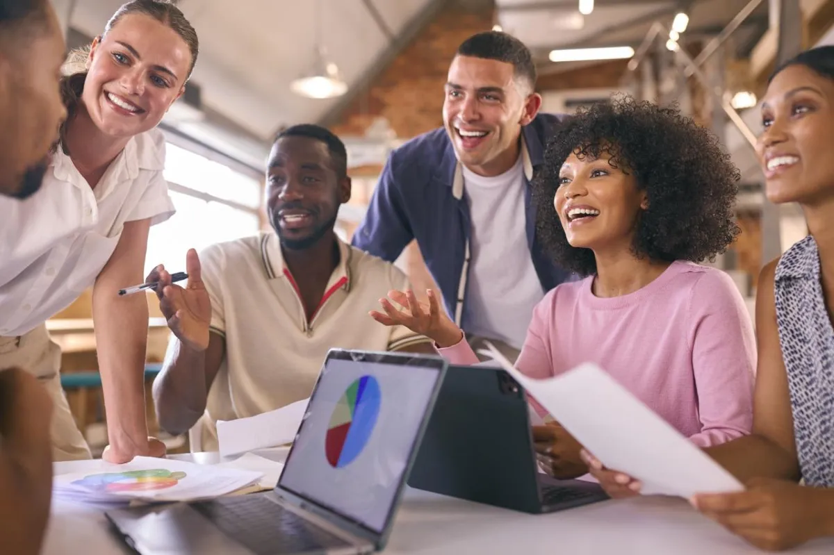 People-Based-SEO-One-to-One-multi-cultural-business-team-meeting-around-desk-i-2024 Large