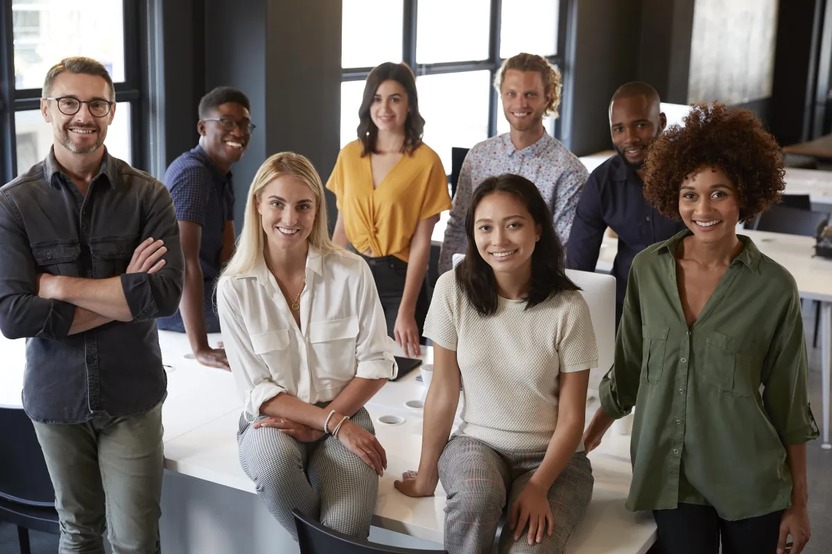 People-Based SEO That Converts Verified-portrait-of-a-creative-business-team-leaning-on-a-2024