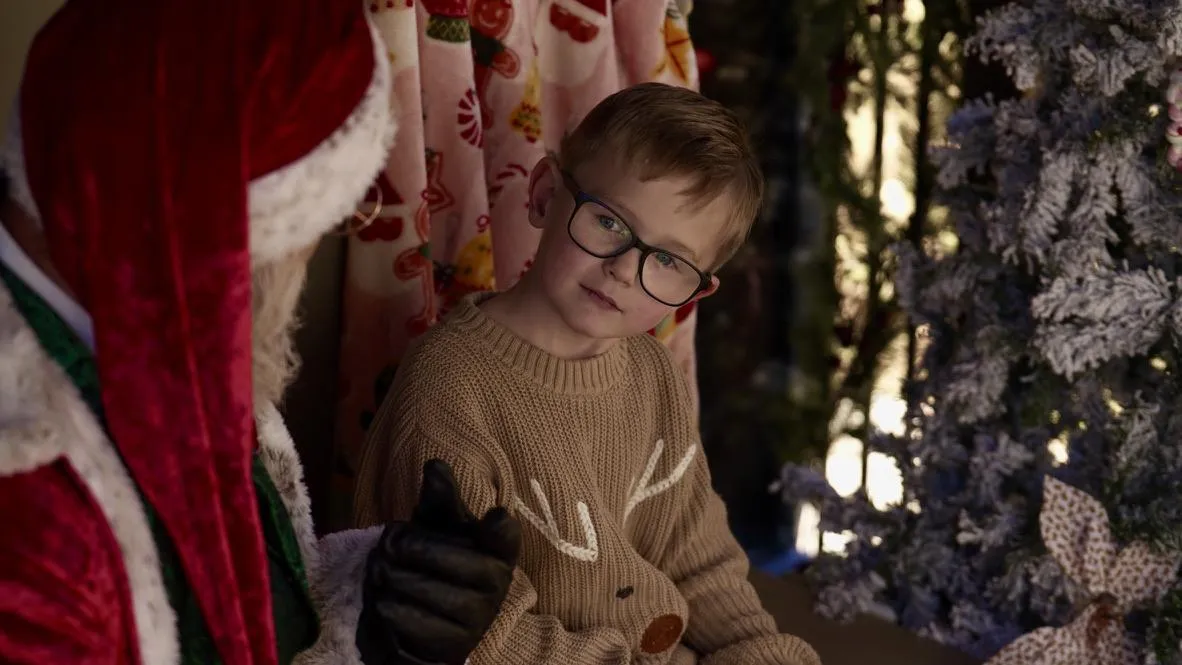 Boy tells Santa what he wants for Christmas
