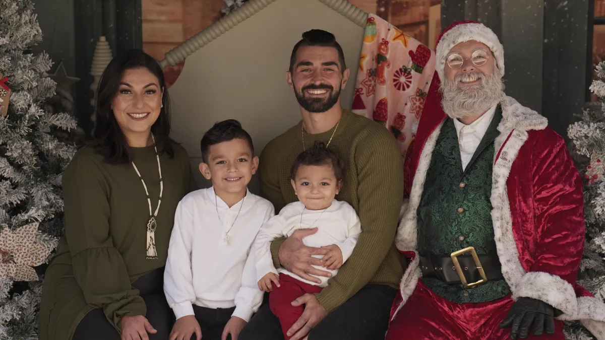 Family portrait with Santa Claus, celebrating a festive holiday moment.