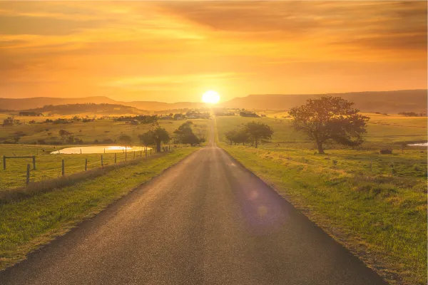 road leading into sunset