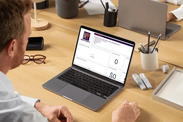 man on laptop looking at dashboard