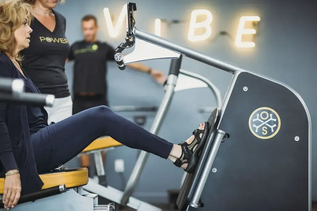 Two women doing plank exercises indoors for winter bone strengthening and osteoporosis prevention in Manhattan