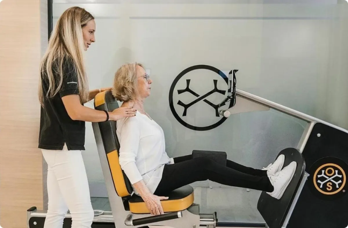 Senior woman exercise at OsteoStrong.