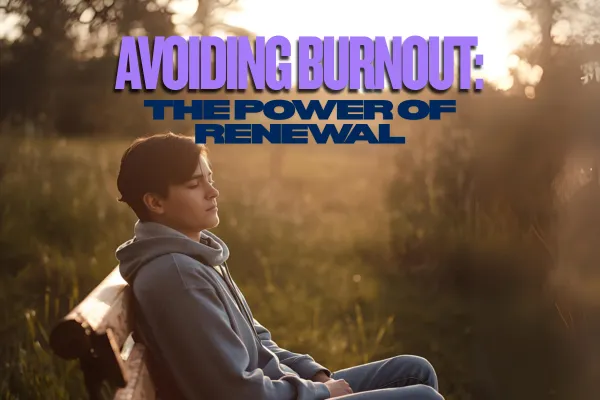 Person relaxing in nature, sunrise in background, symbolizing renewal and avoiding burnout