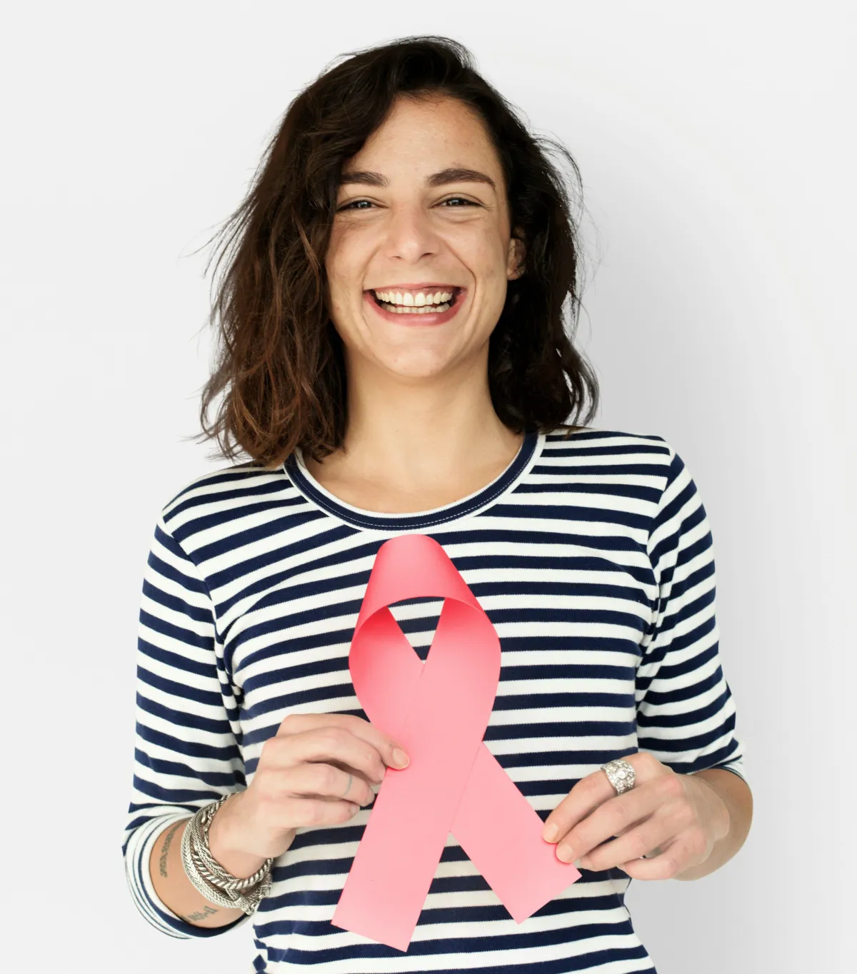 woman holding the breast cancer awareness pink ribbon