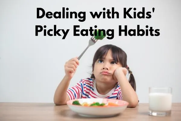 Girl staring at vegetable on fork, looking unhappy - Dealing with Kids' Picky Eating