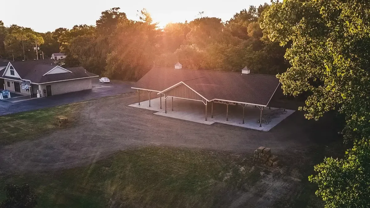 Drone shot of Grass Lake Community events park at sunset